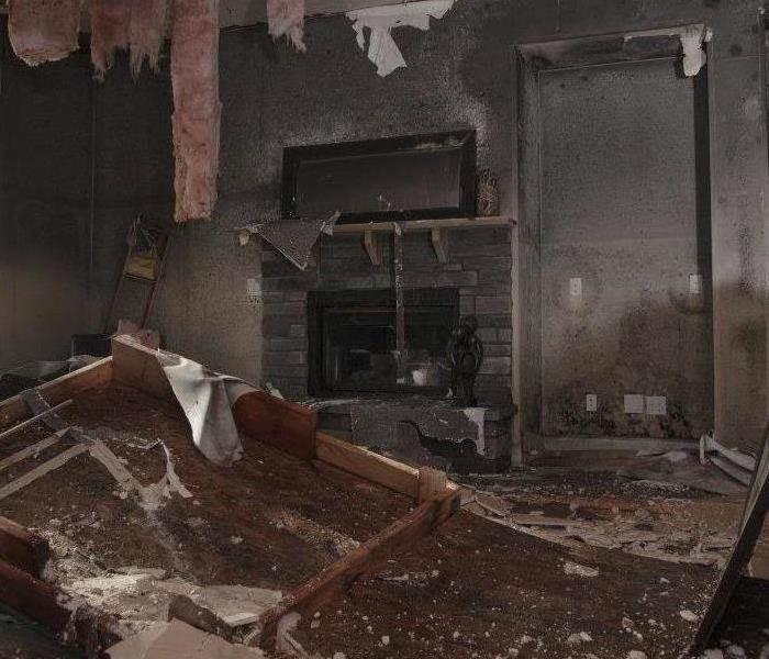 this is a photo of a kitchen, with cabinets scorched. 