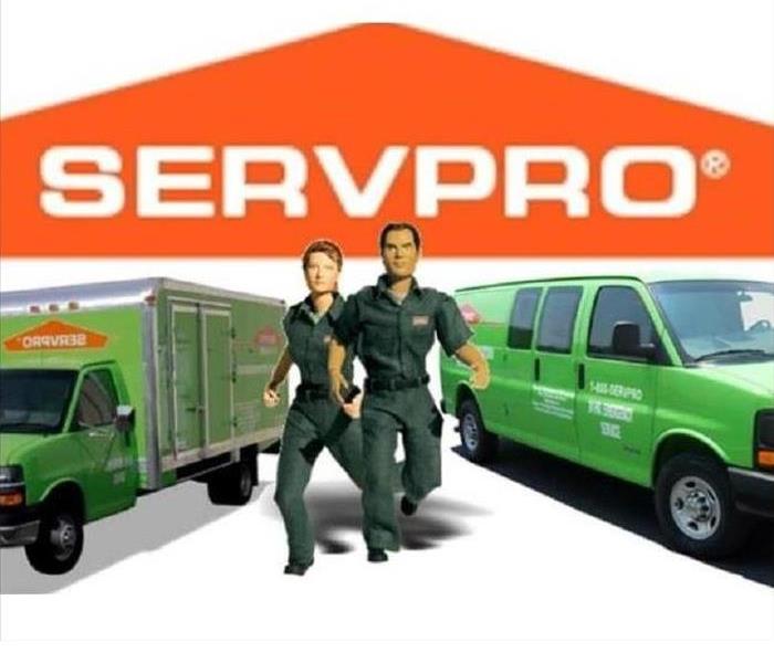 two SERVPRO trucks and two action figures that represent SERVPRO 